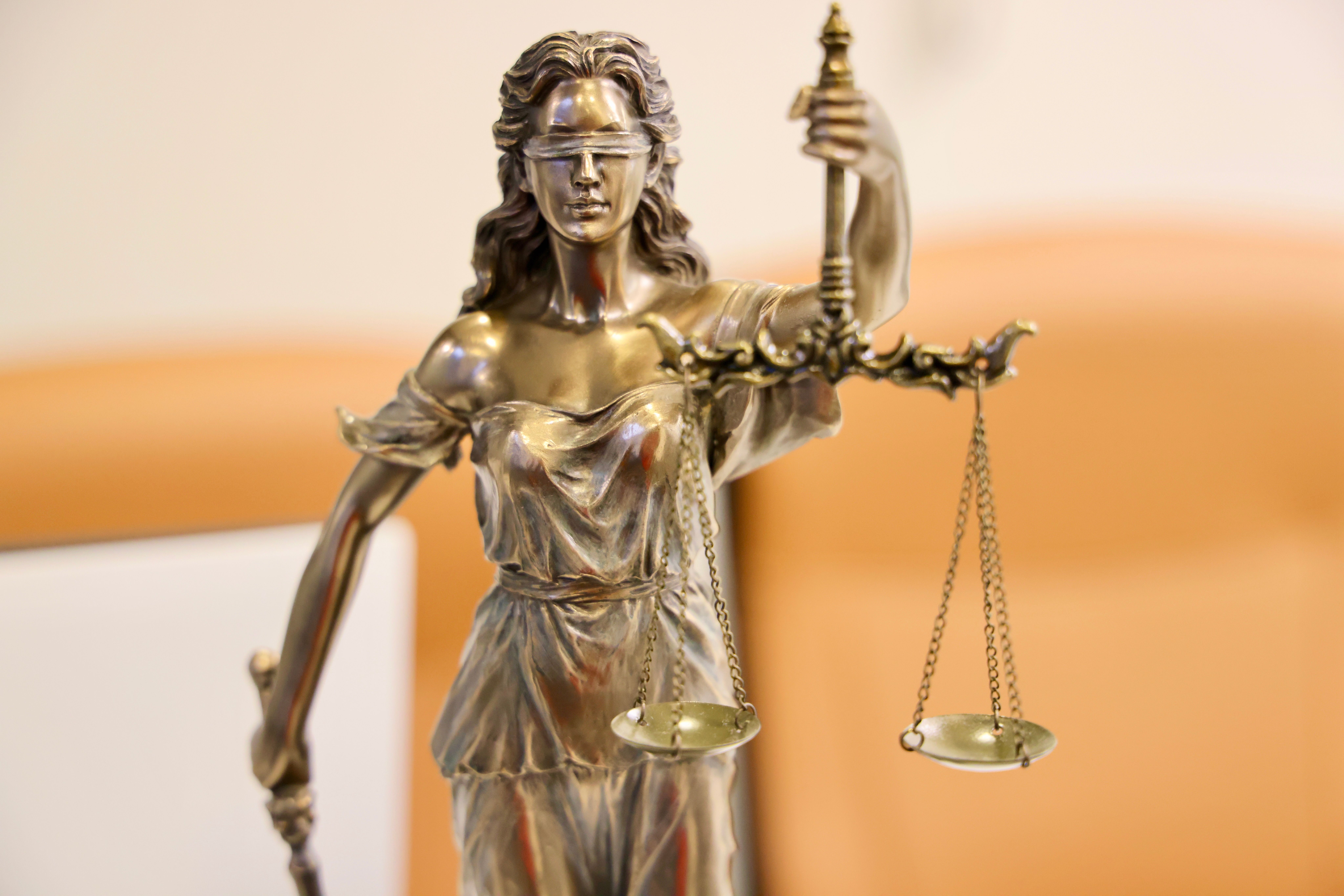 Lady Justice statue symbolizing fair real estate expert witness testimony in Indianapolis